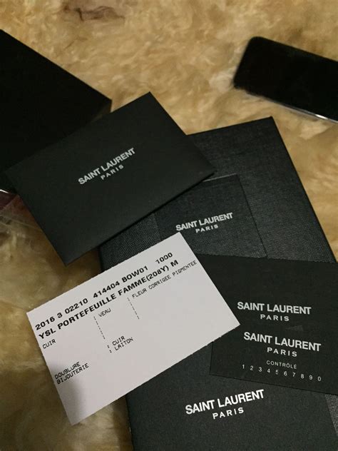 how to tell authentic ysl bag|ysl authenticity check code.